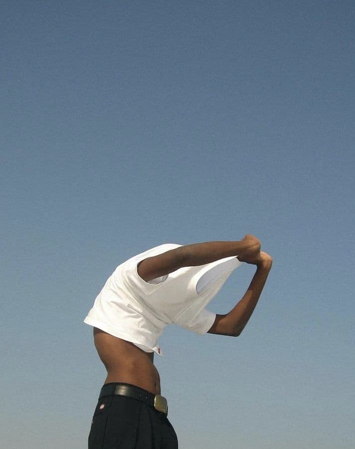 Talent stretching against a blue sky